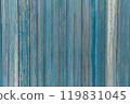 Garage door boards stained blue with worn paint. 119831045