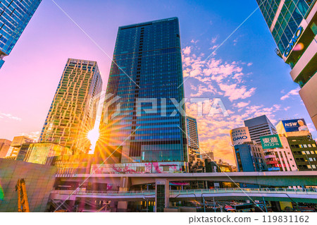 Tokyo cityscape in Japan, overlooking the morning sun, the west exit of Shibuya Station, and buildings. A ray of hope... = October 21st Tokyo cityscape in Japan, overlooking the morning sun, the west exit of Shibuya Station, and buildings. A ray of hope... = October 21st 119831162