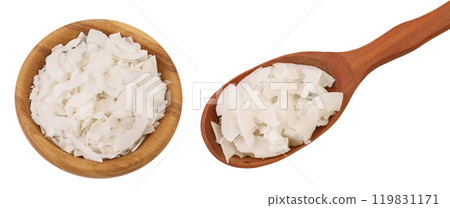 Coconut flakes or chips in wooden bowl and spoon isolated on white background. Top view. Flat lay 119831171