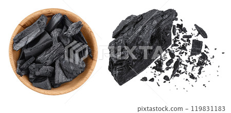 Natural charcoal in wooden bowl isolated on white background with full depth of field. Top view. Flat lay Natural charcoal in wooden bowl isolated on white background with full depth of field. Top view. Flat lay 119831183