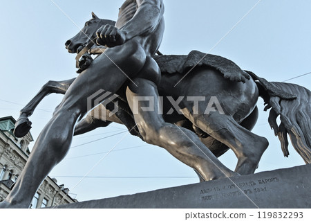 famouse horse sculpture against blue sky: The Horse Tamers, designed by the Russian sculptor, Baron Peter Klodt von Urgensburg. Anichkov bridge, Saint-Petersburg, Russia famouse horse sculpture against blue sky: The Horse Tamers, designed by the Russian sculptor, Baron Peter Klodt von Urgensburg. Anichkov bridge, Saint-Petersburg, Russia 119832293