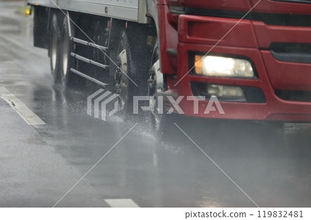 Image of a truck driving in the rain 119832481