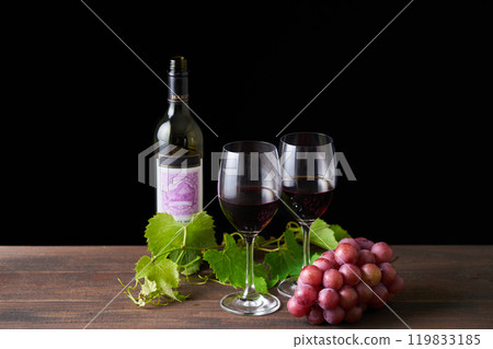 red wine poured into a glass red wine poured into a glass 119833185