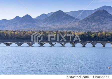 Taushubetsu River Bridge on the former Shihoro Line of the Japanese National Railways on a clear autumn day in Kamishihoro, Hokkaido 119833335