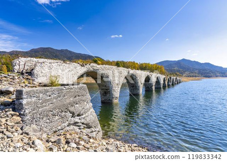 Taushubetsu River Bridge on the former Shihoro Line of the Japanese National Railways on a clear autumn day in Kamishihoro, Hokkaido Taushubetsu River Bridge on the former Shihoro Line of the Japanese National Railways on a clear autumn day in Kamishihoro, Hokkaido 119833342