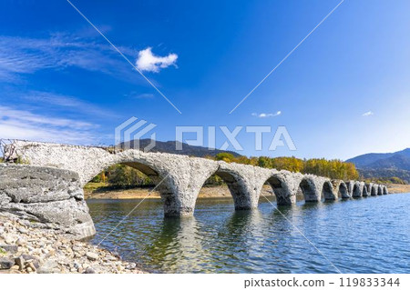 Taushubetsu River Bridge on the former Shihoro Line of the Japanese National Railways on a clear autumn day in Kamishihoro, Hokkaido 119833344