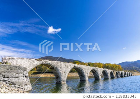 Taushubetsu River Bridge on the former Shihoro Line of the Japanese National Railways on a clear autumn day in Kamishihoro, Hokkaido 119833345