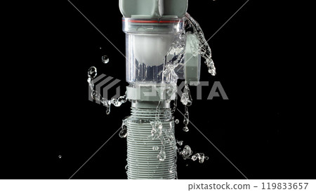 Water leak under sink on Nut Bolt stainless steel. Drain sink leak water from pipe plumbing in bathroom and repair by flume wrench tools as water splash drop. Black background isolated Water leak under sink on Nut Bolt stainless steel. Drain sink leak water from pipe plumbing in bathroom and repair by flume wrench tools as water splash drop. Black background isolated 119833657