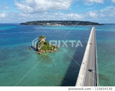 Aerial view of Kouri Bridge and Frog Island on the Motobu Peninsula in Okinawa Prefecture 119834130