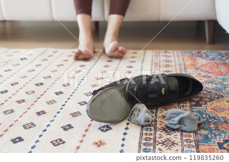 dirty sock and shoe on floor  119835260
