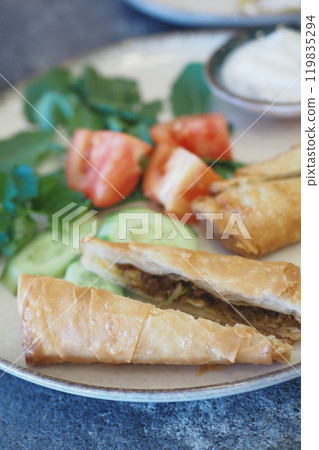 Enjoy our savory pastries filled with fresh veggies and a flavorful dip to enhance the taste Enjoy our savory pastries filled with fresh veggies and a flavorful dip to enhance the taste 119835294