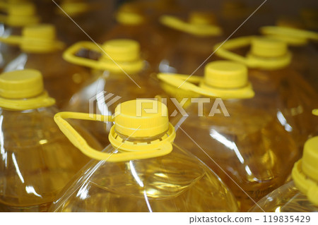 yellow sunflower oil bottle lined up in a store  119835429