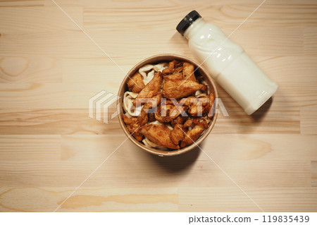 Enjoy a tasty Chicken Bowl with flavorful noodles and creamy sauce to satisfy your cravings 119835439