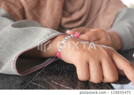 Jeweler bracelet on the female wrist. Jeweler bracelet on the female wrist. 119835475