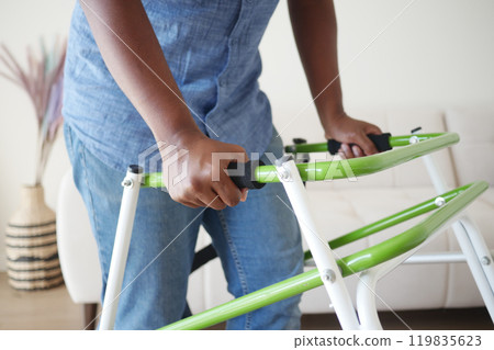 young man with walking frame young man with walking frame 119835623