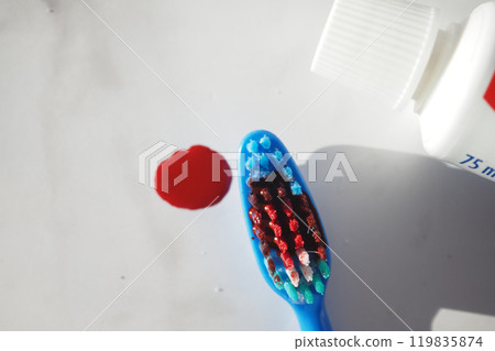 Blood on the toothbrush on background 119835874
