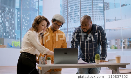 Real estate agent assists corporate clients in planning an office relocation, using architectural blueprints to establish the new urban workspace layout. Business investment strategy. Camera A. Real estate agent assists corporate clients in planning an office relocation, using architectural blueprints to establish the new urban workspace layout. Business investment strategy. Camera A. 119837502