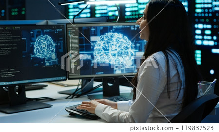 Team of engineers doing checkup on server hub to optimize it for data processing requirements of AI workloads. Teamworking colleagues inspect data center used for machine learning, camera A 119837523