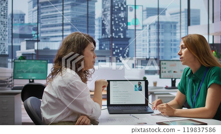 Human resources staff evaluating job applicant and examining their resumes during selection process, corporate job offer. Recruiters selecting candidates based on work experience. Camera B. 119837586