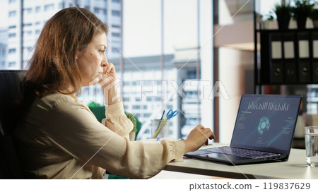 Woman general director managing multiple expansion projects, showcasing her multitasking abilities, organizational and leadership skills. CEO working with commitment to business success. Camera B. Woman general director managing multiple expansion projects, showcasing her multitasking abilities, organizational and leadership skills. CEO working with commitment to business success. Camera B. 119837629