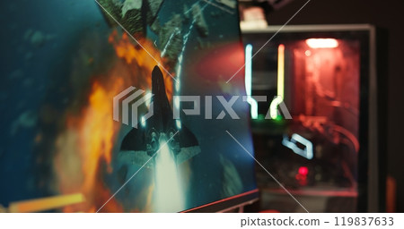 Player using keyboard and mouse to play videogame on gaming PC in neon lit apartment. Gamer using high tech computer peripherals to destroy enemies, relaxing at home, camera B close up Player using keyboard and mouse to play videogame on gaming PC in neon lit apartment. Gamer using high tech computer peripherals to destroy enemies, relaxing at home, camera B close up 119837633