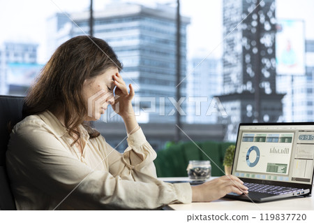 Frustrated financial banker analyzing investment insights and trading risks before spending money for company development. Evaluating data analytics and budget reports, tired CEO. 119837720