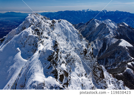 A view of the Ryuzu Peak, Gongendake and Southern Alps from Mount Akadake in the Yatsugatake Mountain Range in midwinter 119838423