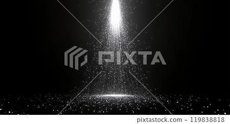 A beam of light shines down through a shower of sparkling particles. A beam of light shines down through a shower of sparkling particles. 119838818