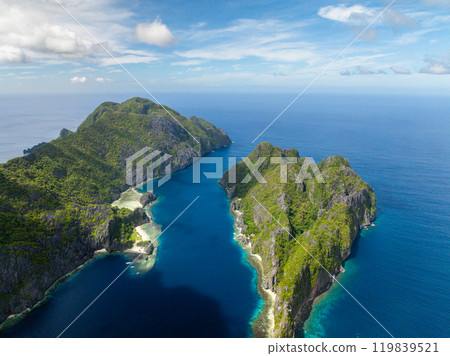 Tropical Islands with blue sea. Tapiutan and Matinloc. El Nido, Philippines. Tropical Islands with blue sea. Tapiutan and Matinloc. El Nido, Philippines. 119839521