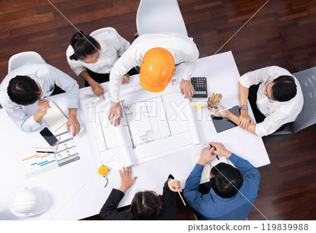 Diverse group of civil engineer and client working on architect. Prudent 119839988