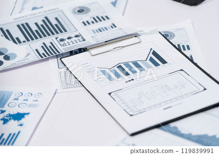 Piles of business intelligence paper or BI financial report. Prudent 119839991