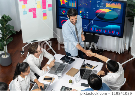 Analyst team leader shake hand with colleague after successful meeting. Prudent Analyst team leader shake hand with colleague after successful meeting. Prudent 119841089