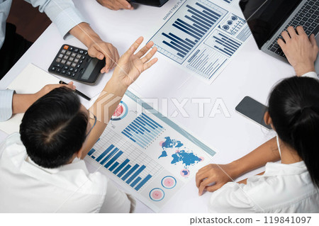 Analyst team utilizing BI Fintech to analyze financial data at table. Prudent Analyst team utilizing BI Fintech to analyze financial data at table. Prudent 119841097