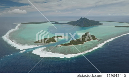 Aerial view panorama of Maupiti, volcanic island surrounded by turquoise lagoon and coral reef motu ocean, creating breathtaking tropical landscape in French Polynesia. Remote wild nature paradise 119843440