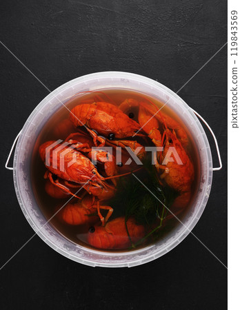 Red Crayfish in Saucepan, Top View on Dark Background. 119843569
