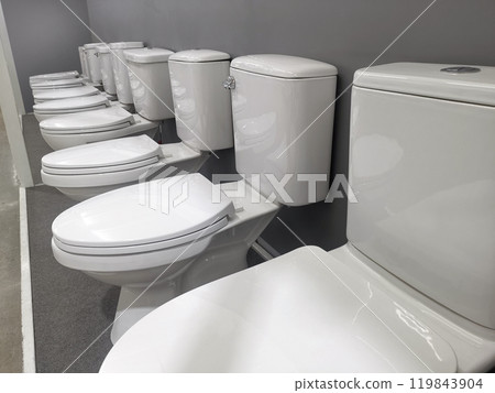 New modern toilet in the plumbing store. Samples of modern sanitary ware for the toilet New modern toilet in the plumbing store. Samples of modern sanitary ware for the toilet 119843904