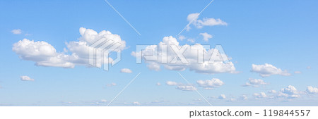 Expansive blue sky panorama with scattered white cumulus clouds, peaceful daytime skyscape for relaxing visuals, broad horizon cloud formation banner, background or wallpaper design Expansive blue sky panorama with scattered white cumulus clouds, peaceful daytime skyscape for relaxing visuals, broad horizon cloud formation banner, background or wallpaper design 119844557