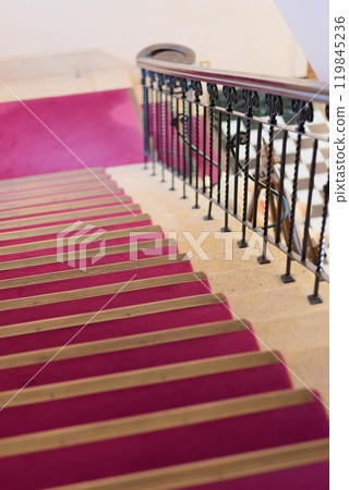 A retro staircase with a red carpet in a Western-style building 119845236