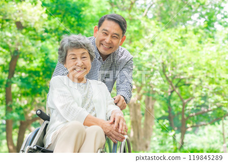 Senior woman, middle-aged man, parent and child, wheelchair Senior woman, middle-aged man, parent and child, wheelchair 119845289