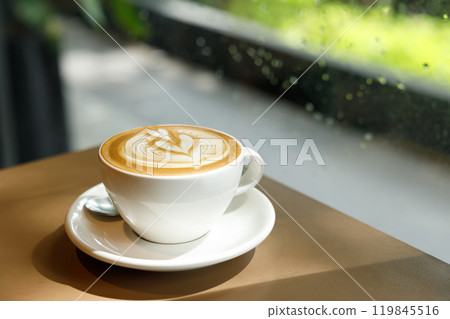 Cup of hot latte coffee on table 119845516