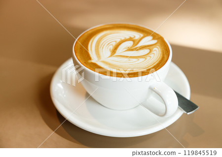 Cup of hot latte coffee on table 119845519