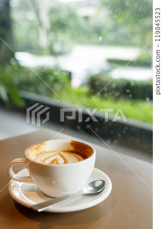 Cup of hot latte coffee on table Cup of hot latte coffee on table 119845523