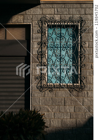 The Elegant Wrought Iron Window Design prominently features in exquisite Italian Architecture and cultural heritage The Elegant Wrought Iron Window Design prominently features in exquisite Italian Architecture and cultural heritage 119845702