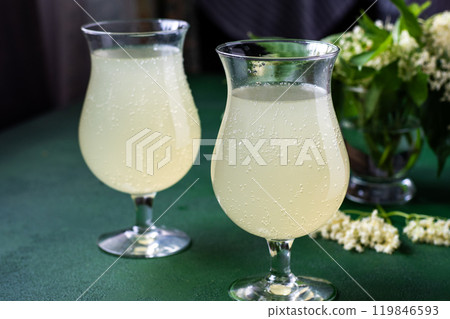 Carbonated elderflower drink. Flower summer kvass in glasses 119846593
