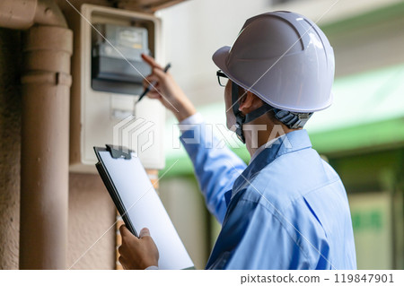 Workers inspecting Workers inspecting 119847901