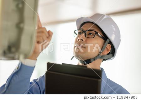 Workers inspecting Workers inspecting 119847903