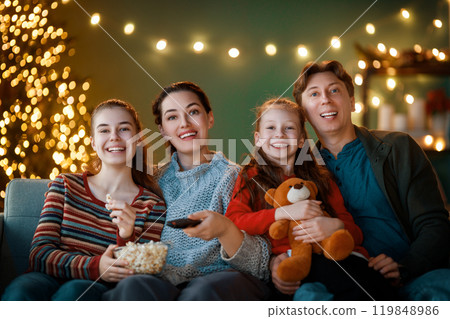 family watching holiday movies at home family watching holiday movies at home 119848986