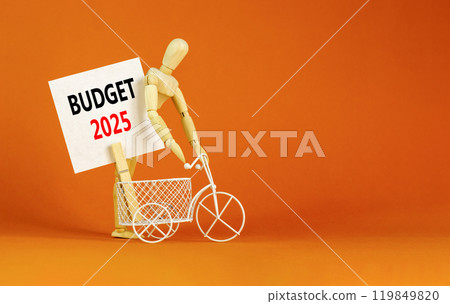 Planning budget 2025 new year symbol. Concept words Budget 2025 on beautiful white paper on wooden clothespin. Bicycle. Beautiful orange background. Business budget 2025 new year concept. Copy space. 119849820