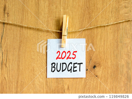 Planning 2025 budget new year symbol. Concept words 2025 Budget on beautiful white paper on wooden clothespin. Beautiful wooden background. Business 2025 budget new year concept. Copy space. 119849826