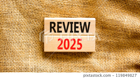 Planning review 2025 new year symbol. Concept words Review 2025 on beautiful wooden blocks. Beautiful canvas background. Business review 2025 new year concept. Copy space. 119849827